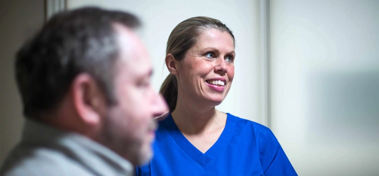 Palliative care nurse with patient